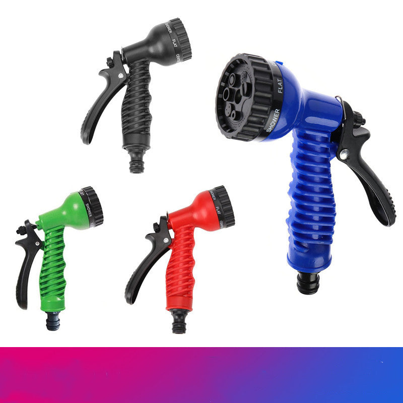 Coil garden hose in use watering garden