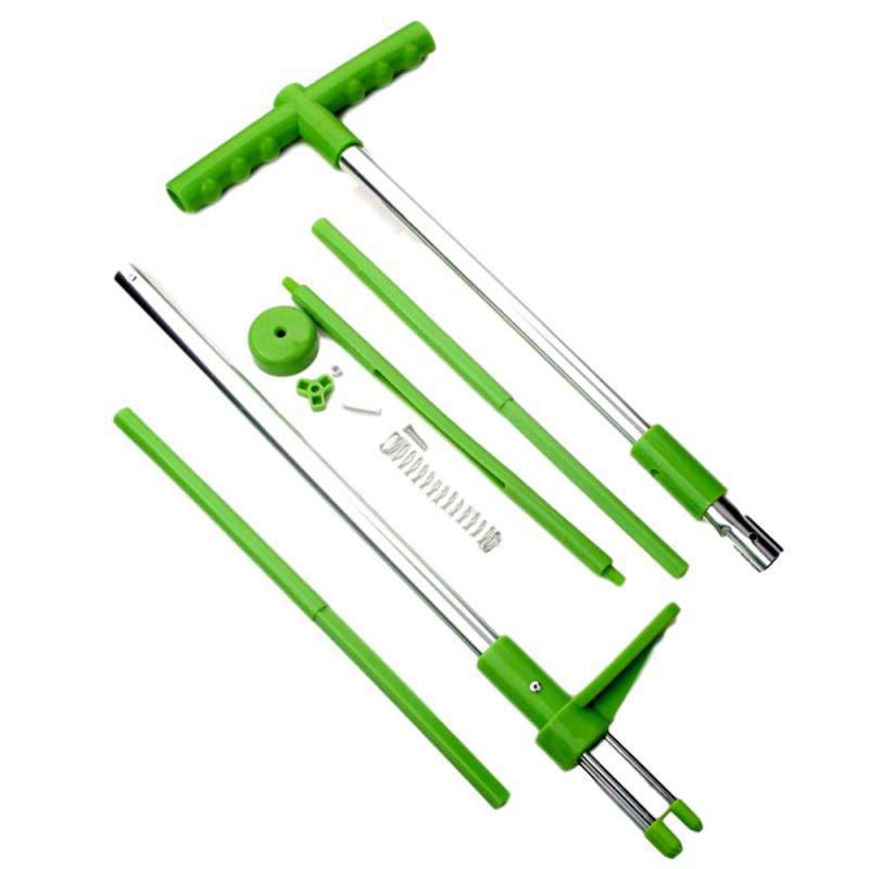 Long handle root remover tool in lawn