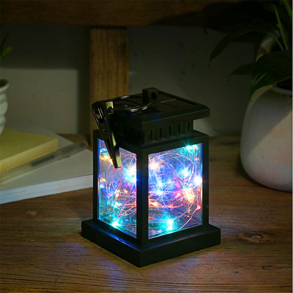 Solar hanging lantern with multicolour LED fairy lights glowing