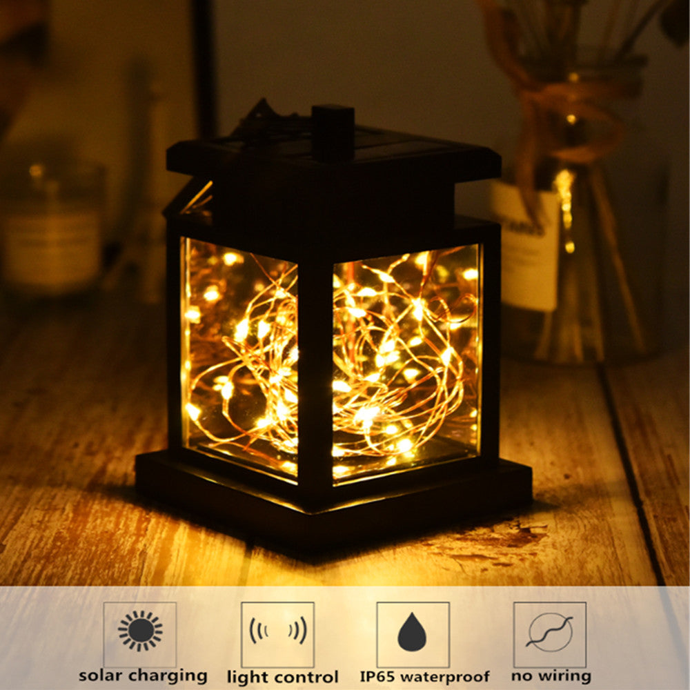 Solar garden lantern with warm fairy lights at night