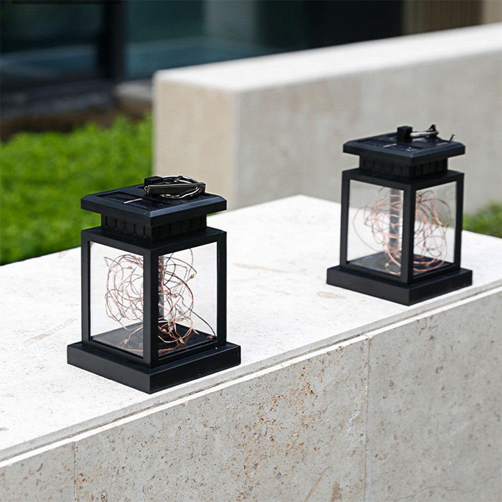 Solar LED lantern hanging in garden